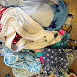 4 bottoms 8 tops pile of bikinis